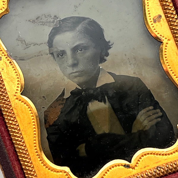 Ambrotype of a little terror / young boy in a half case (child portrait)