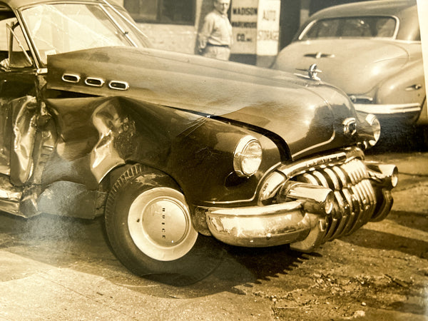 Three 8 x 10 photographs of a wrecked Buick, ca. 1950
