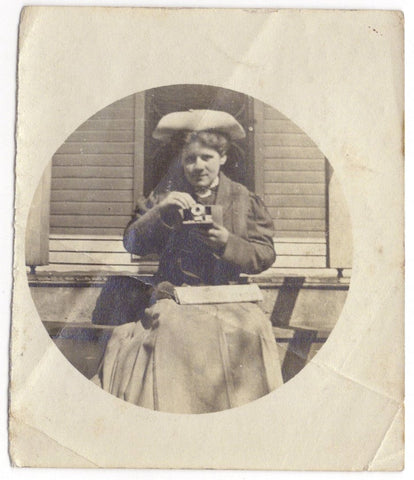 Vernacular photograph of a woman and her camera (self-portrait?)