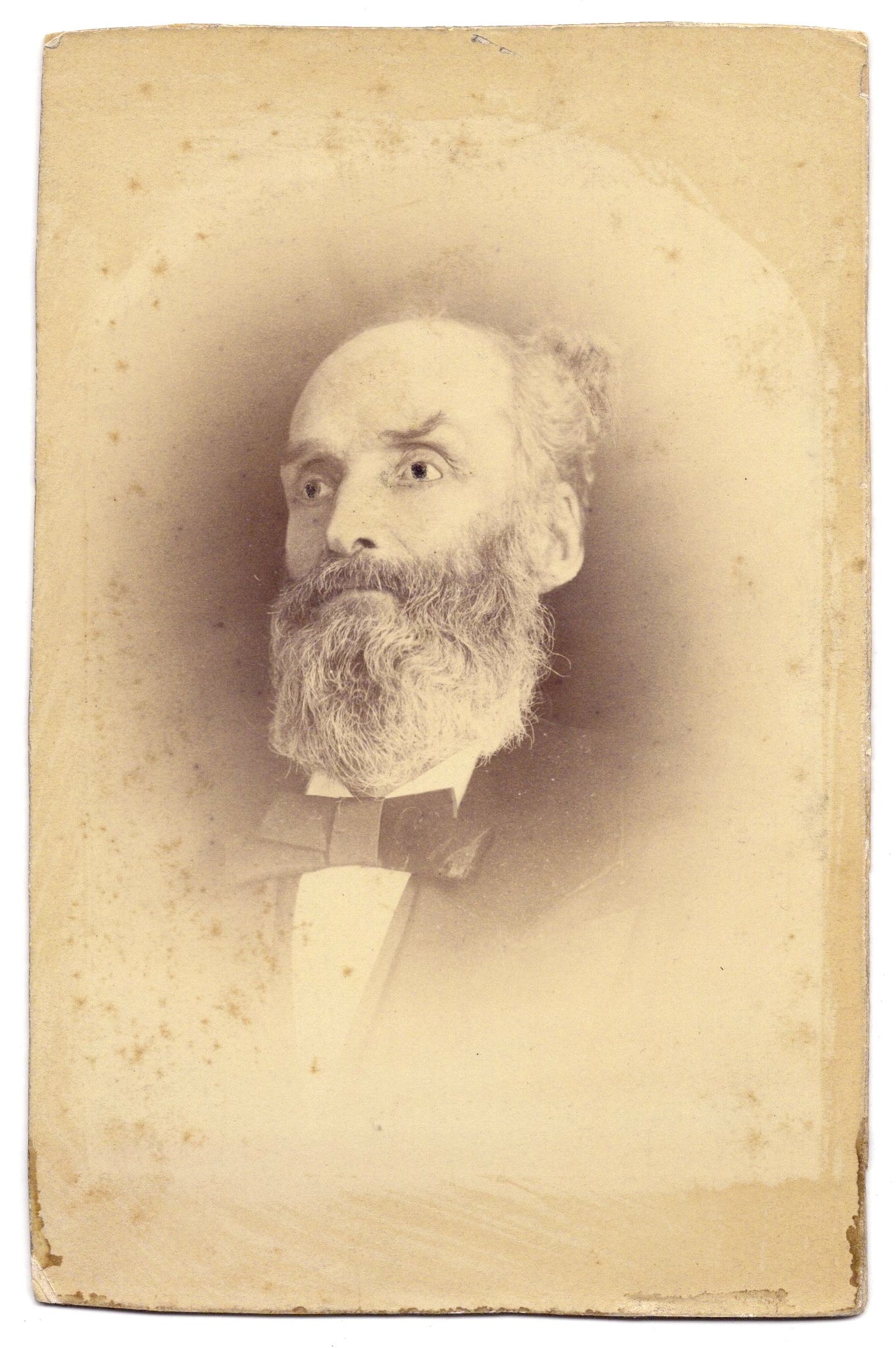 Studio portrait of an artificially wide-eyed man (Victorian Post-Mortem photograph)