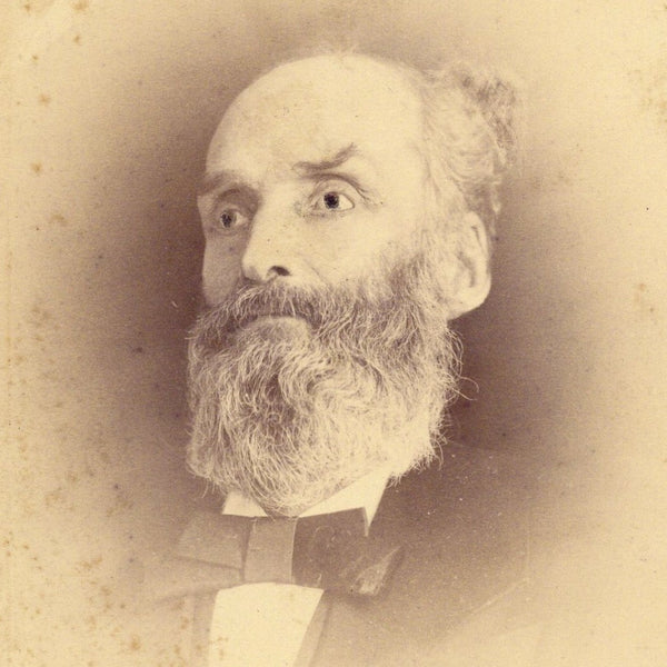 Studio portrait of an artificially wide-eyed man (Victorian Post-Mortem photograph)