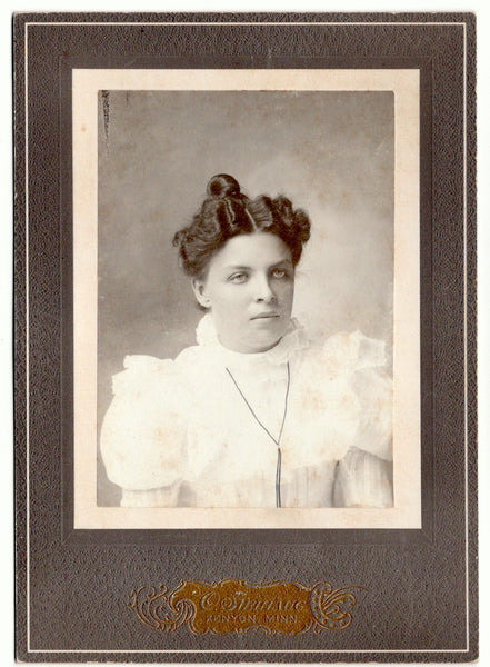 Cabinet cards of two women with their eyes