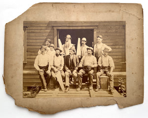 Occupational portrait of nine carpenters and a child