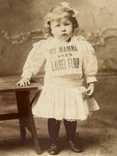 Cabinet card photograph of a child advertising Laurel Flour