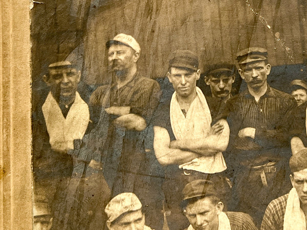 Occupational portrait of sixteen men, two with "Little Minister" caps