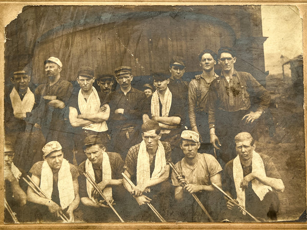 Occupational portrait of sixteen men, two with "Little Minister" caps