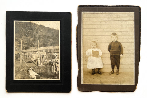 Two cabinet photographs with young children holding things at chest height