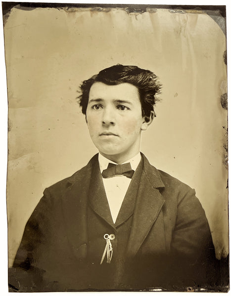 Two tintype portraits of boys with rosy cheeks