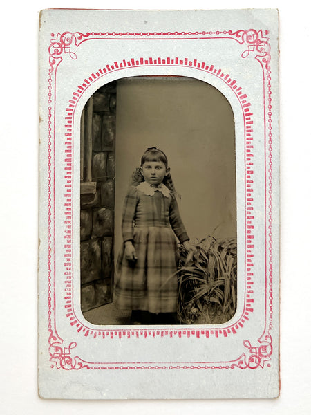 Tintype of a girl and CDV of a boy holding --