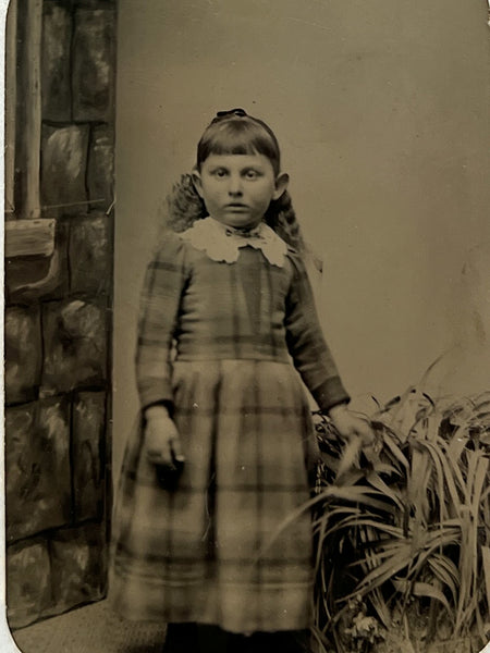 Tintype of a girl and CDV of a boy holding --