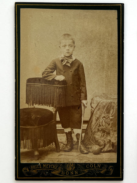 Tintype of a girl and CDV of a boy holding --