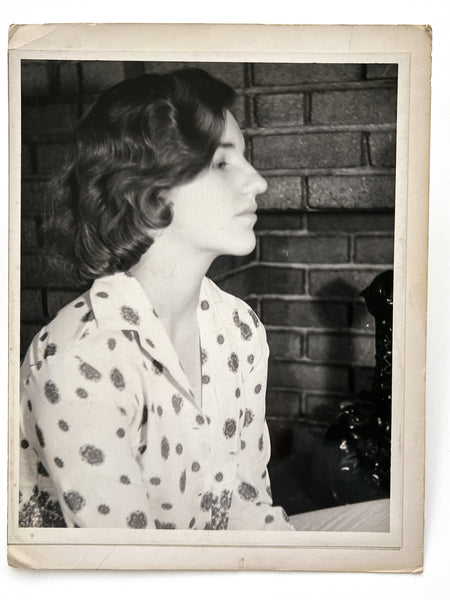 12 photographs of the same woman in various stages of enthusiasm and undress