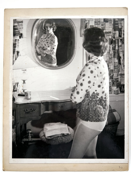 12 photographs of the same woman in various stages of enthusiasm and undress