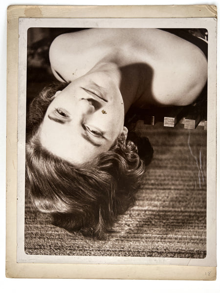 12 photographs of the same woman in various stages of enthusiasm and undress