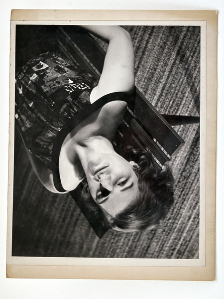 12 photographs of the same woman in various stages of enthusiasm and undress