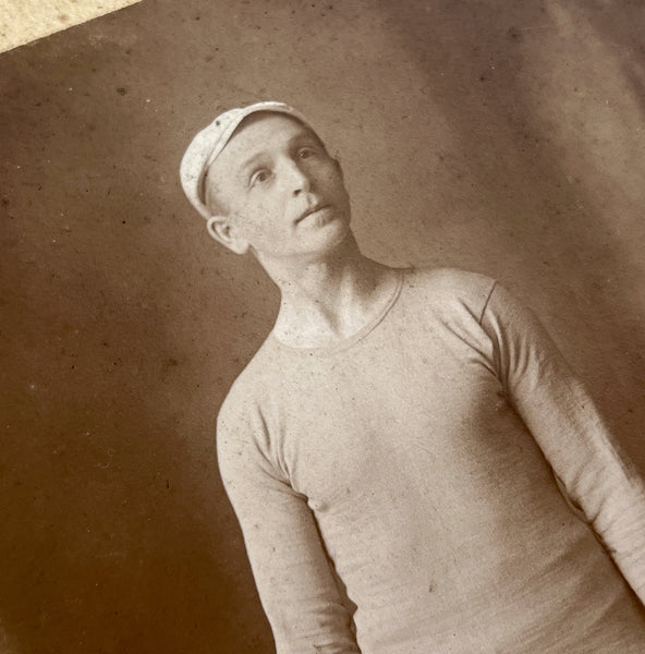 Large cabinet photo of a nobly aloof man in short-shorts on roller skates