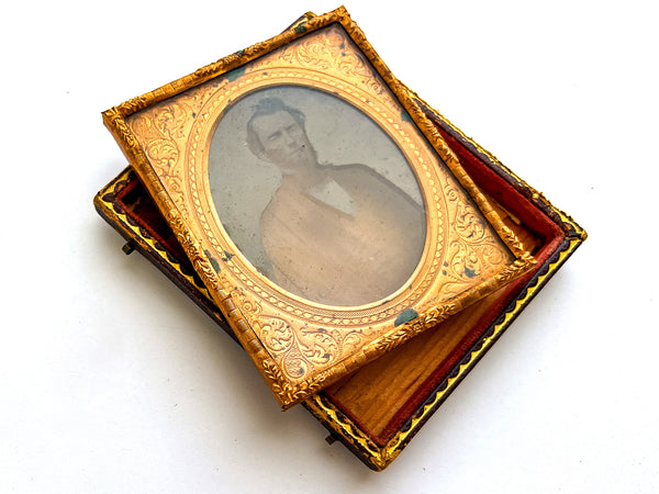 Intriguingly damaged sixth plate ambrotype of Augustus Blakesley in full case