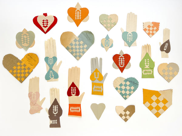 Collection of 22 woven paper pockets and heart-in-hand love tokens, ca. 1927