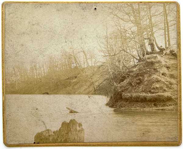 Three men on a riverbank, something underwater (cabinet card, landscape)