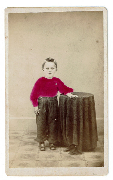 Cabinet photograph of a nonplussed Victorian boy